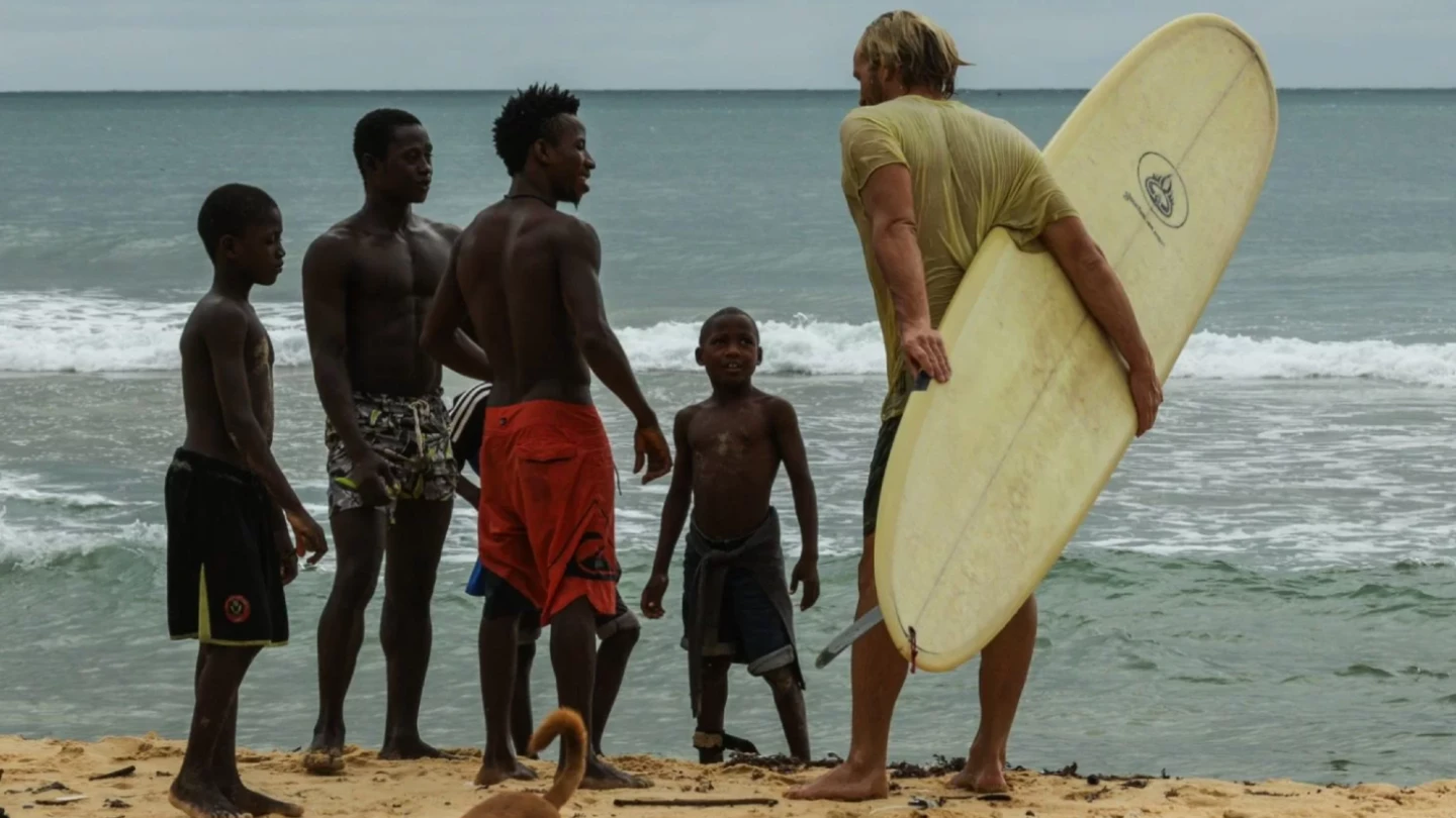 African Territory still image at the beach with African kids and surfboard