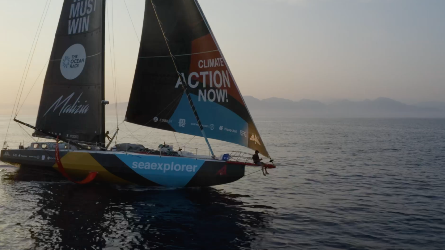 Still image from trailer showing sailing boat of team Malizia